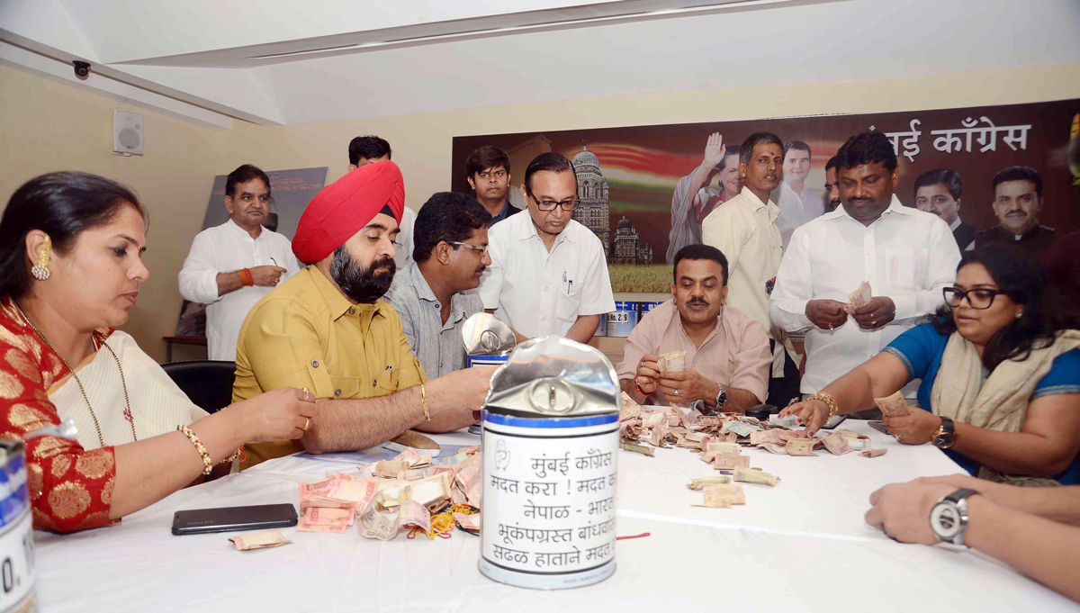 Mumbai Congress President Sanjay Nirupam with Party Workers Opened Money Boxes Collected for Nepal Earthquake Relief Fund.