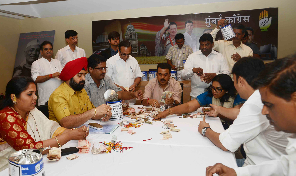 Mumbai Congress President Sanjay Nirupam with Party Workers Opened Money Boxes Collected for Nepal Earthquake Relief Fund.