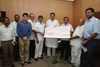 MINISTER NARAYANRAO RANE PRESENTED A CHEQUE OF Rs.1 CRORE TO CHIEF MINISTER RELIFE FUND AT VIDHAN BHAVAN.