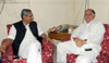 Union Minister Of State For Home, Telecommunications, Post And IT Gurudas Kamat Met Newly Appointed AICC. In Charge For Maharashtra Mohan Prakash At Congress HQ 24 Akbar Road in New Delhi.